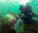 Researcher Bennett Lambert assists with FlowCytobot at the Martha's Vineyard Coastal Observatory.